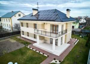 Modern residential house with solar panel system on roof.